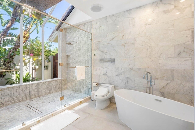 bathroom with toilet, a skylight, independent shower and bath, tile walls, and tile flooring