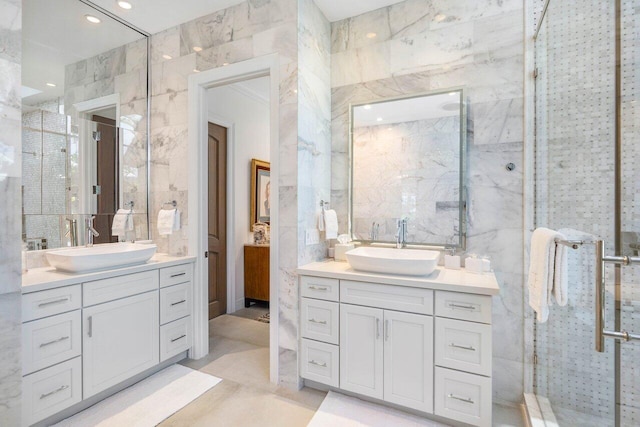 bathroom with tile walls, tile flooring, dual sinks, and oversized vanity