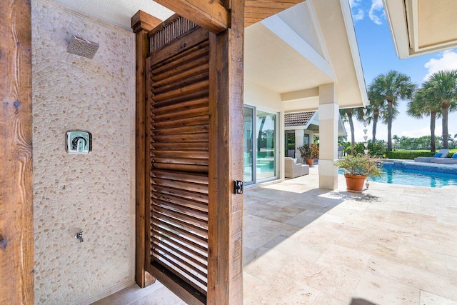 property entrance featuring a patio