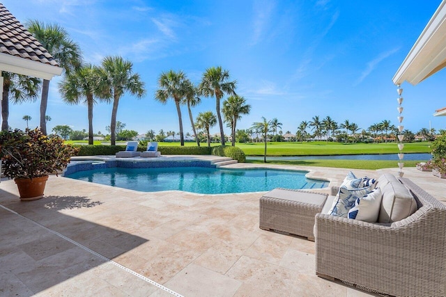 view of pool with a lawn and a patio area