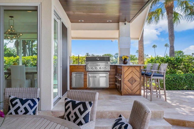 view of patio / terrace featuring area for grilling and a grill