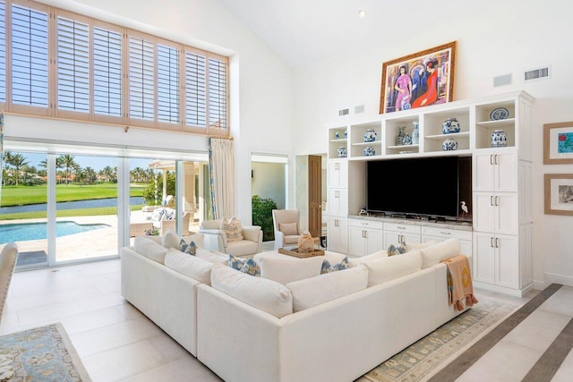 living room featuring high vaulted ceiling