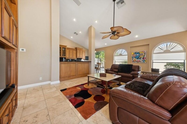 tiled living room with high vaulted ceiling and ceiling fan