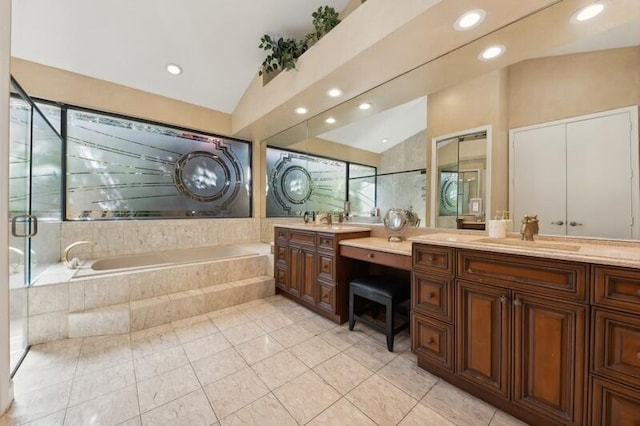 bathroom featuring vanity, shower with separate bathtub, lofted ceiling, and tile patterned flooring