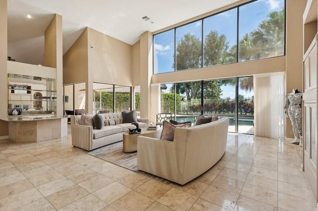 living room with a towering ceiling