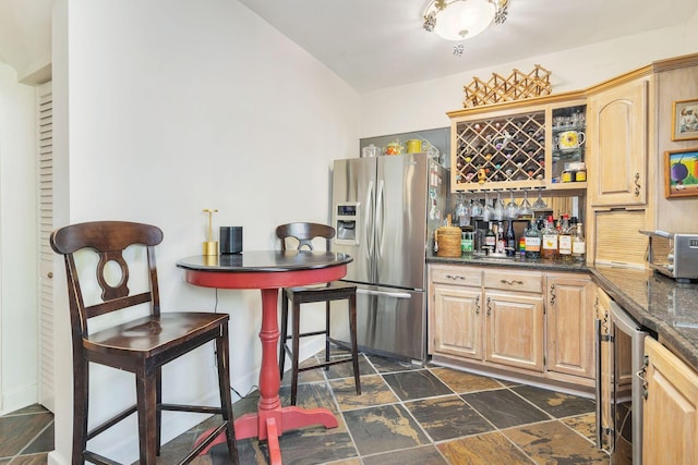 kitchen featuring light brown cabinetry, stainless steel fridge, and wine cooler