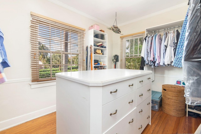 spacious closet with light hardwood / wood-style floors