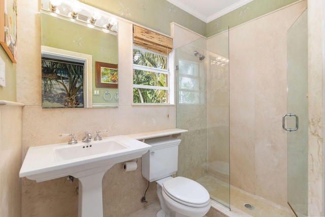 bathroom with toilet, crown molding, and an enclosed shower