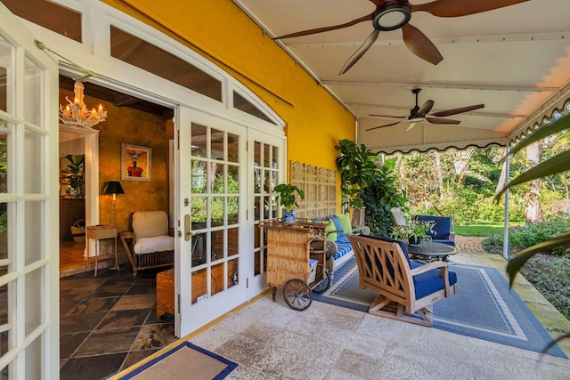 view of patio / terrace featuring ceiling fan and french doors