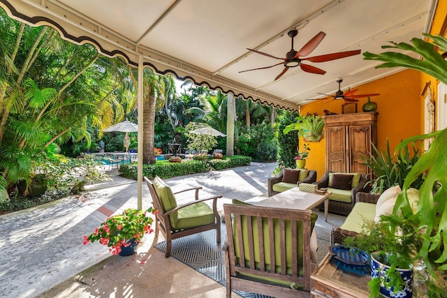 view of patio featuring ceiling fan, an outdoor living space, and a pool