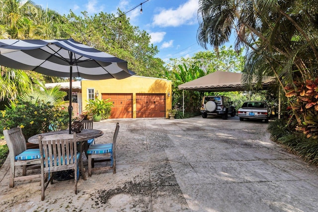 view of patio with a garage and a carport