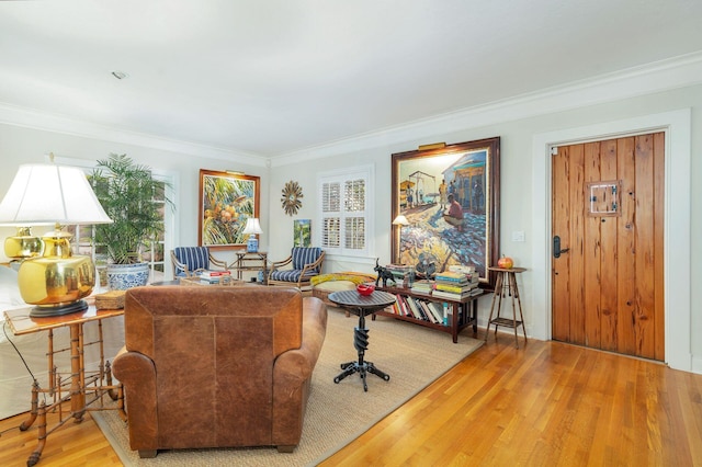 interior space featuring wood-type flooring and ornamental molding