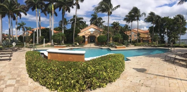 view of swimming pool featuring a patio area