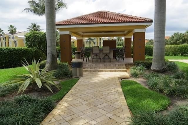 surrounding community featuring a gazebo and an outdoor bar