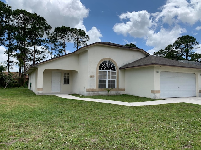 view of front facade with a front yard and a garage