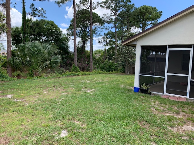 view of yard with a sunroom