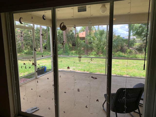 unfurnished sunroom featuring a wealth of natural light