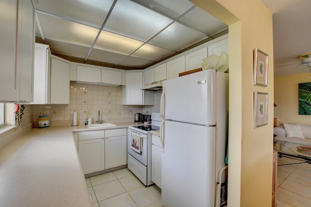 kitchen with light tile floors, ceiling fan, tasteful backsplash, white appliances, and white cabinetry