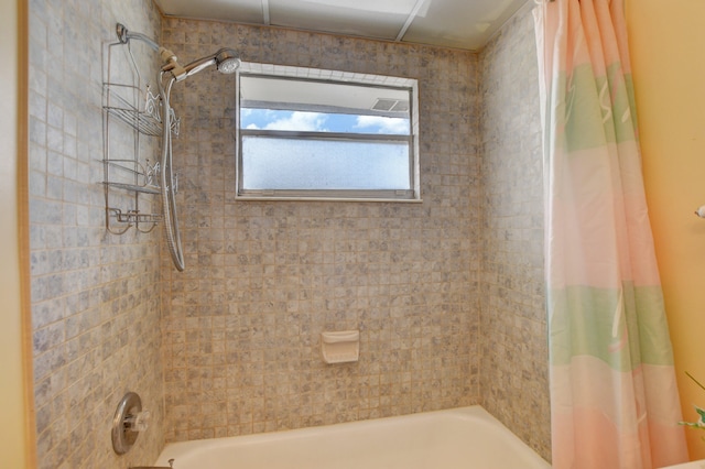 bathroom with shower / bath combo