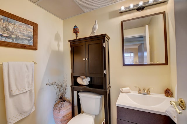 bathroom featuring toilet and vanity