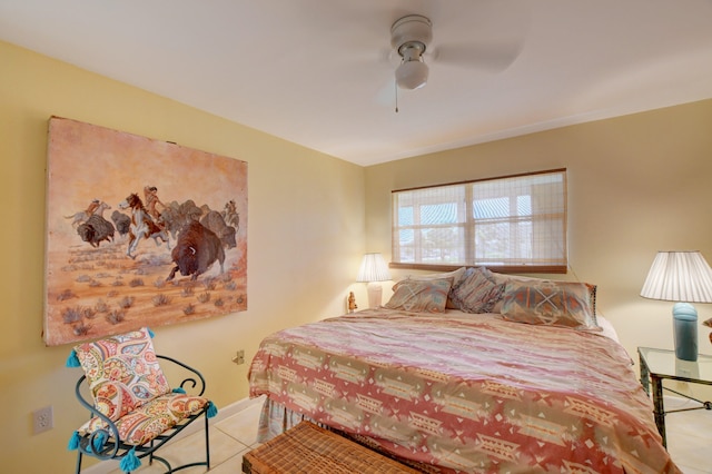 tiled bedroom with ceiling fan