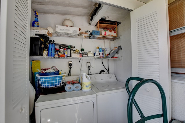 laundry room with hookup for an electric dryer and independent washer and dryer