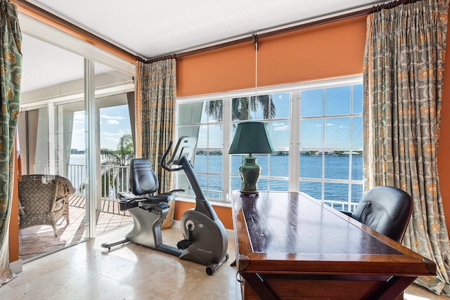 interior space featuring tile flooring and a water view