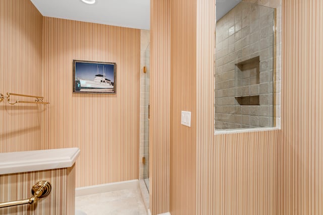 bathroom with walk in shower and tile floors