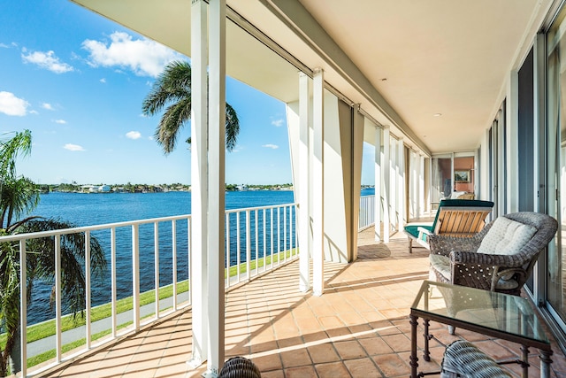 balcony featuring a water view