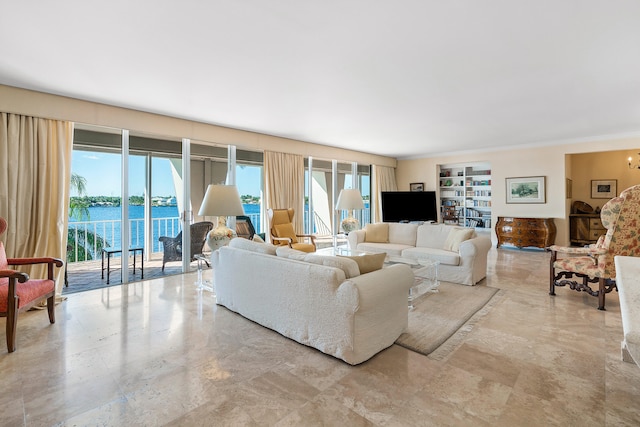 tiled living room featuring a water view