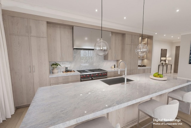 kitchen featuring light stone countertops, pendant lighting, a kitchen bar, sink, and light brown cabinets