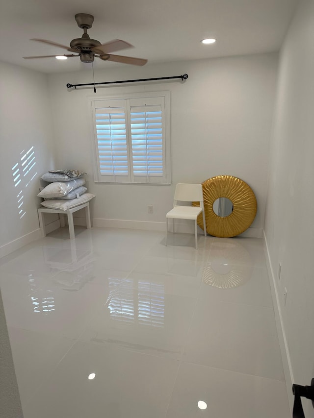 unfurnished room with light tile flooring and ceiling fan