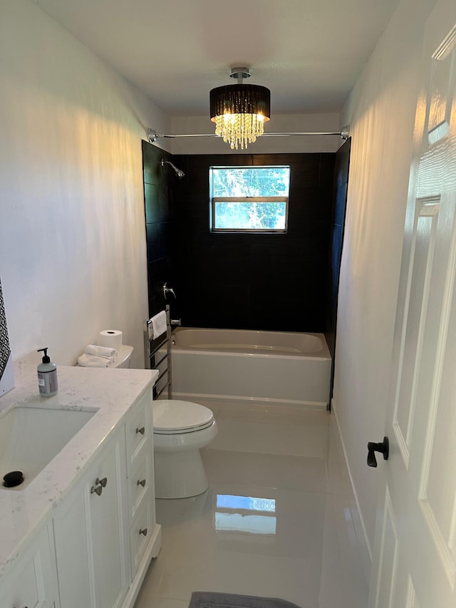 full bathroom with vanity, toilet, tile floors, and tiled shower / bath