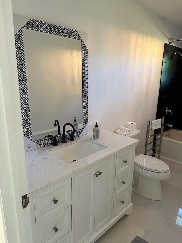 full bathroom featuring vanity, tile floors, toilet, and tiled shower / bath