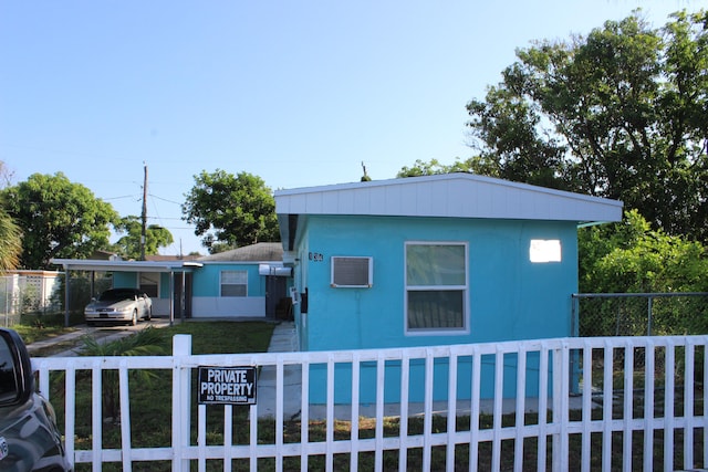 view of front of property featuring a swimming pool