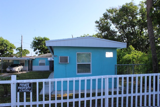 view of side of property featuring a pool