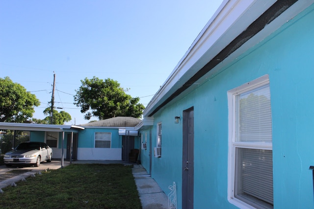 view of side of property featuring a carport