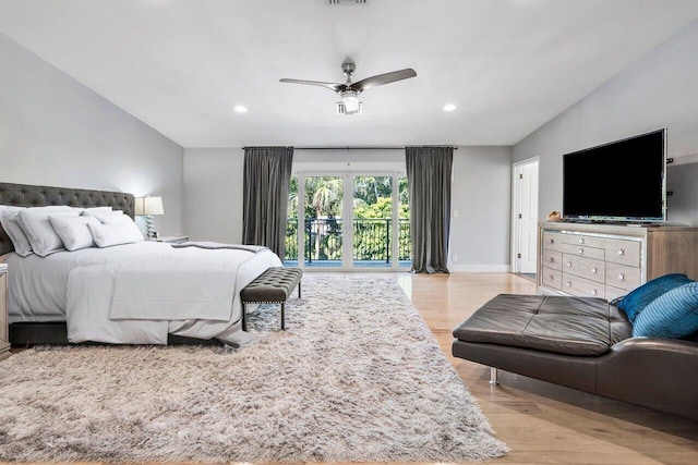 bedroom featuring access to exterior, ceiling fan, and light hardwood / wood-style flooring