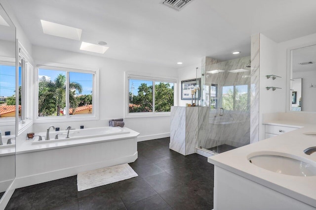 bathroom with vanity, plus walk in shower, tile floors, and a skylight