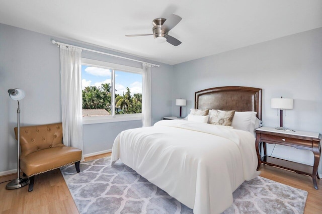 bedroom featuring ceiling fan and light hardwood / wood-style flooring