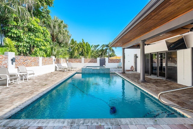 view of swimming pool featuring a patio area