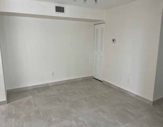 empty room featuring light tile floors