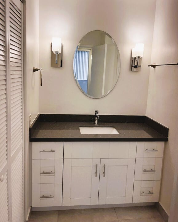 bathroom featuring vanity with extensive cabinet space