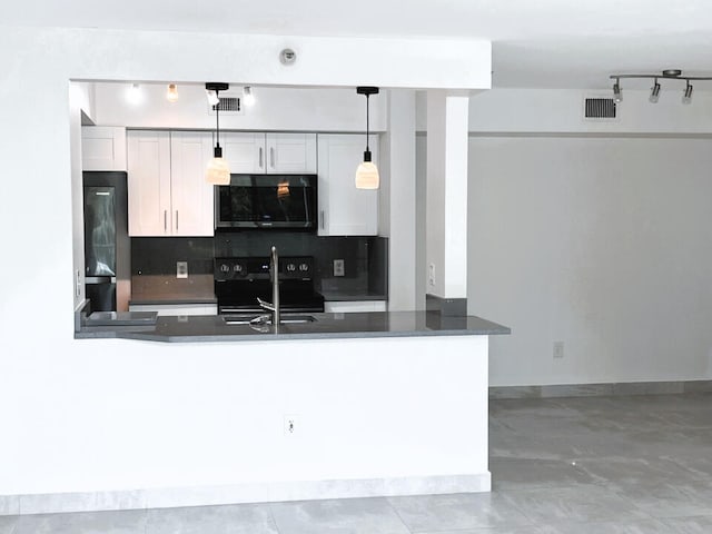 kitchen featuring white cabinetry, pendant lighting, kitchen peninsula, and black appliances