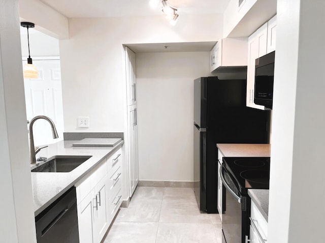 kitchen featuring white cabinets, rail lighting, black appliances, and sink