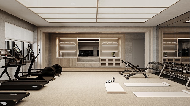 exercise room with carpet flooring