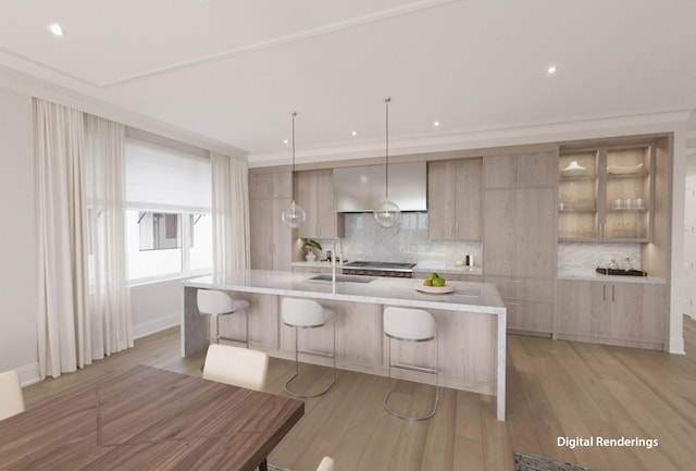 kitchen featuring sink, decorative light fixtures, decorative backsplash, and light hardwood / wood-style floors