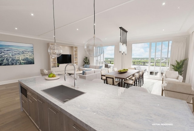 kitchen with decorative light fixtures, light stone countertops, dark hardwood / wood-style floors, and sink