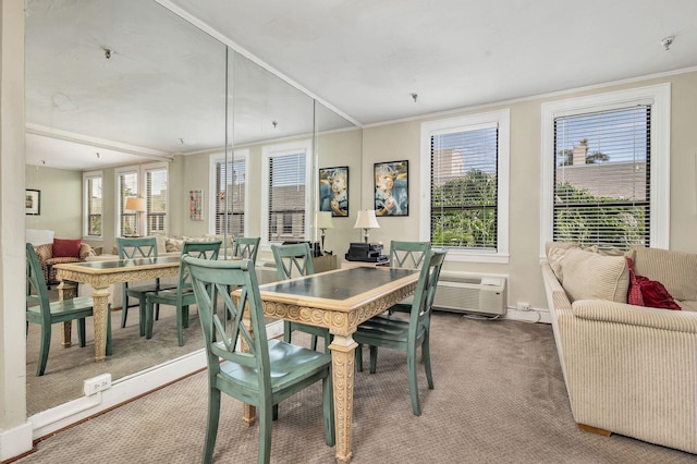 dining area featuring dark carpet and ornamental molding