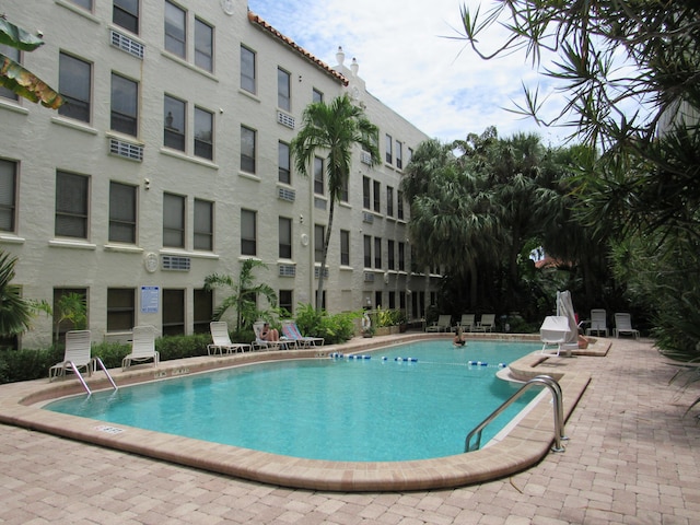 view of swimming pool with a patio